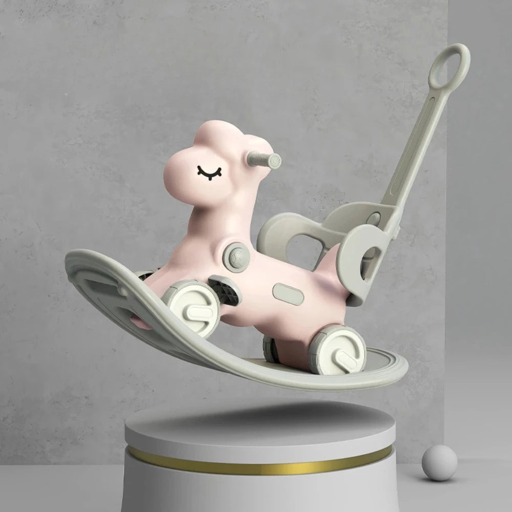 Pink rocking horse toy on a gray background
